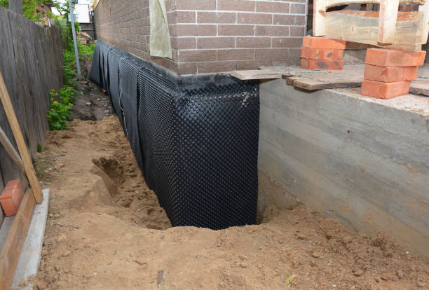 Happy homeowners after waterproofing job in Comstock Park